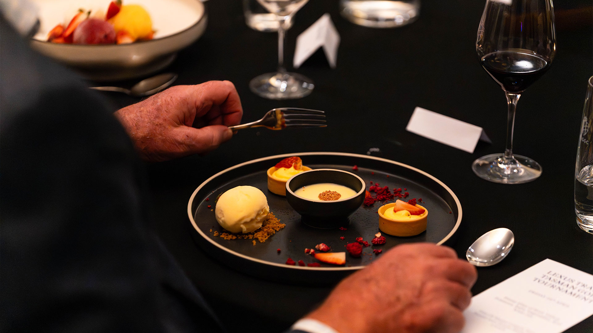 Person dining at restaurant, close up of food on plate