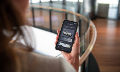 Woman using Lexus Connected app
